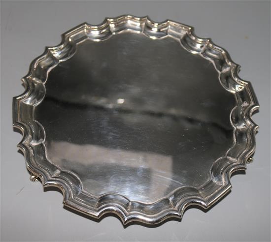 A 1930s silver salver with piecrust border, 18 oz.